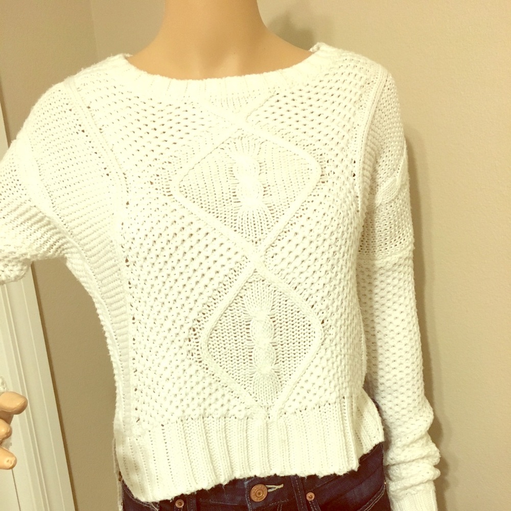 Delia’s white knit sweater